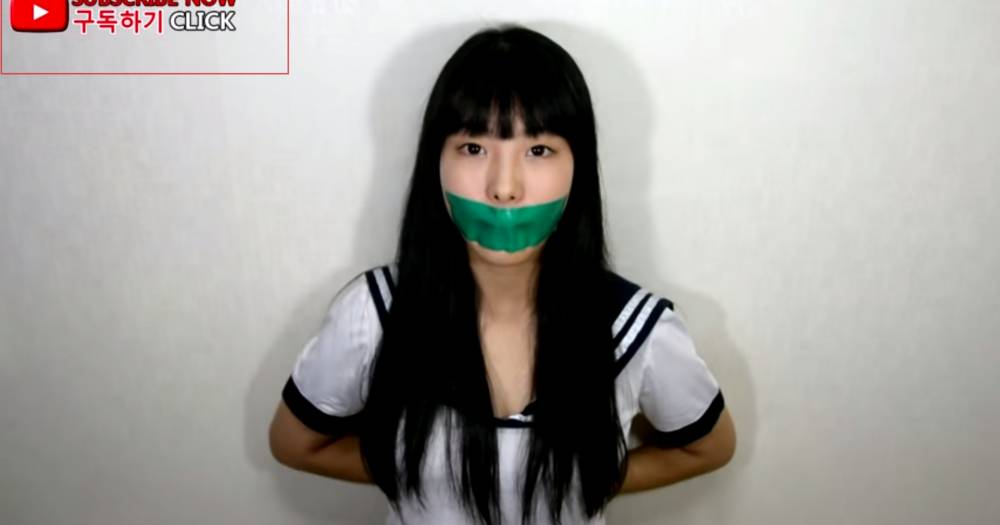 Girl straitjacket gagged tape chairtied photos