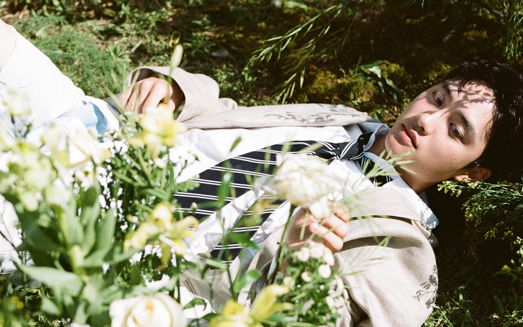 EXO's D.O. radiates his innocent charms in a bed of wildflowers for his ...